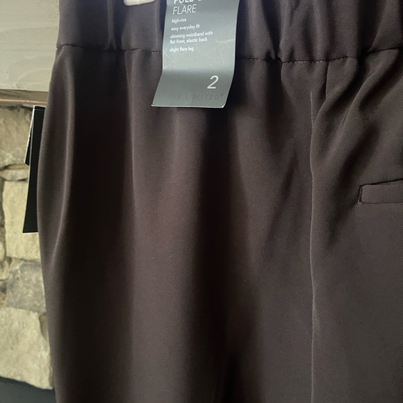 Limited pull on flare leg trousers. - Picture 1 of 5